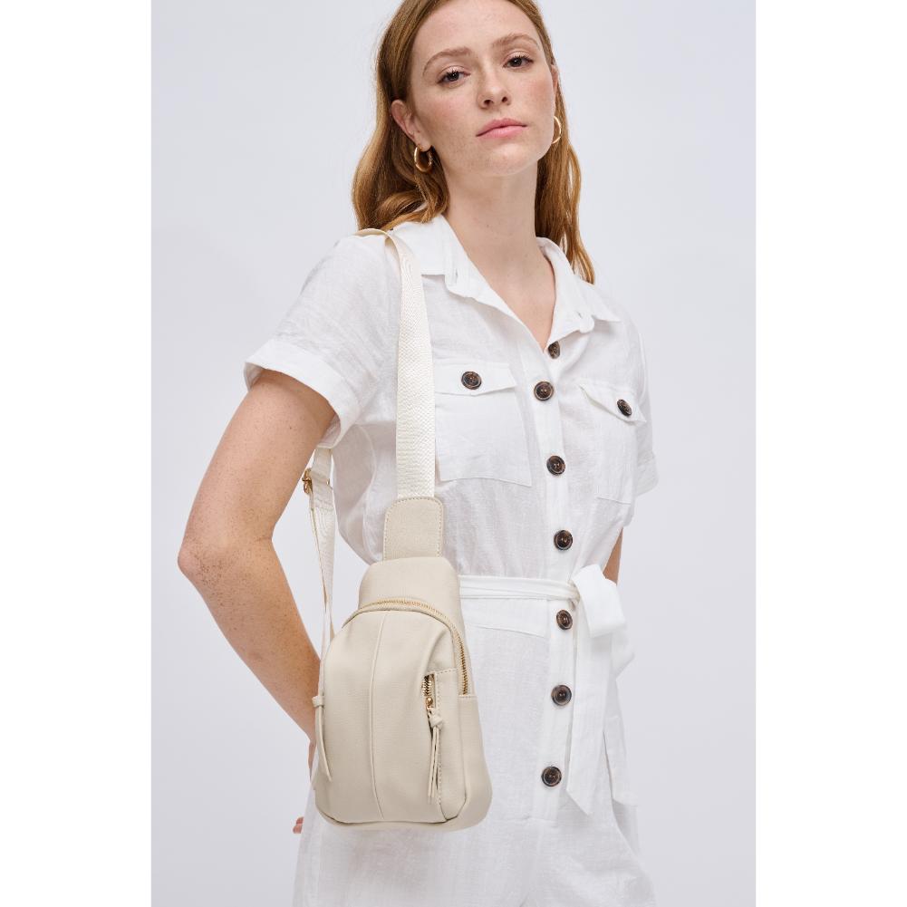 Woman wearing Ivory Urban Expressions Emille Sling Backpack 840611191564 View 1 | Ivory