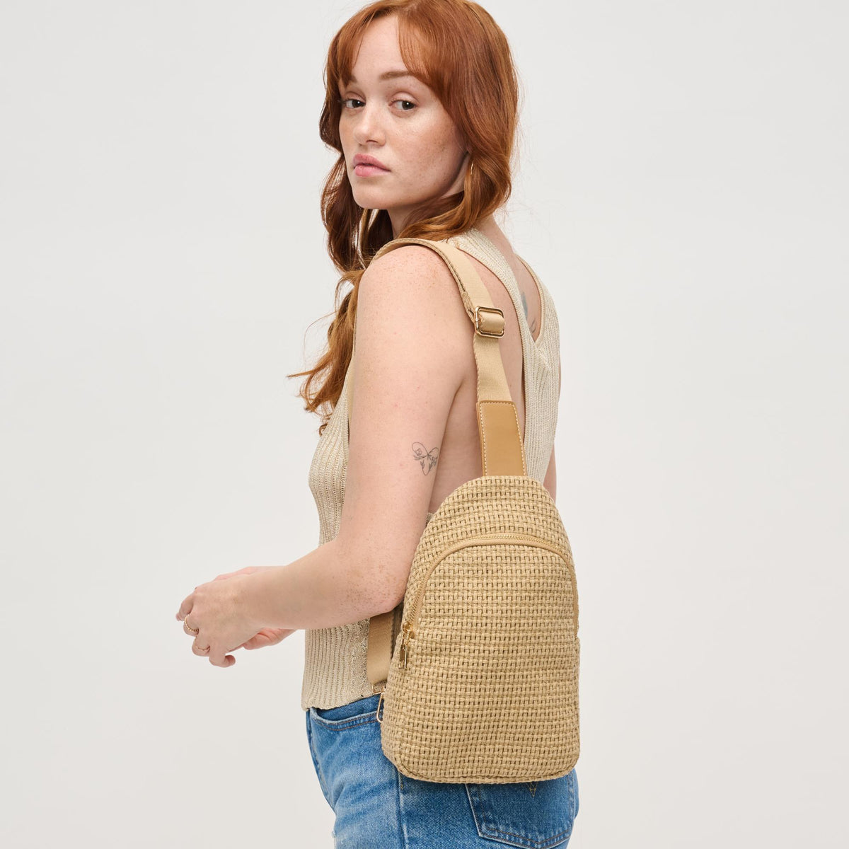 Woman wearing Natural Urban Expressions Jean Sling Backpack 840611146533 View 1 | Natural