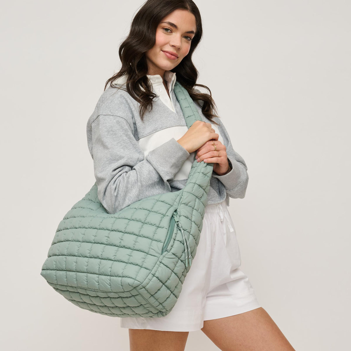 Woman wearing Sage Urban Expressions Leda Hobo 840611142702 View 2 | Sage