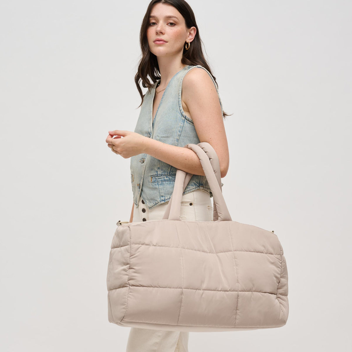 Woman wearing Natural Urban Expressions Freyja Duffel 840611124296 View 1 | Natural