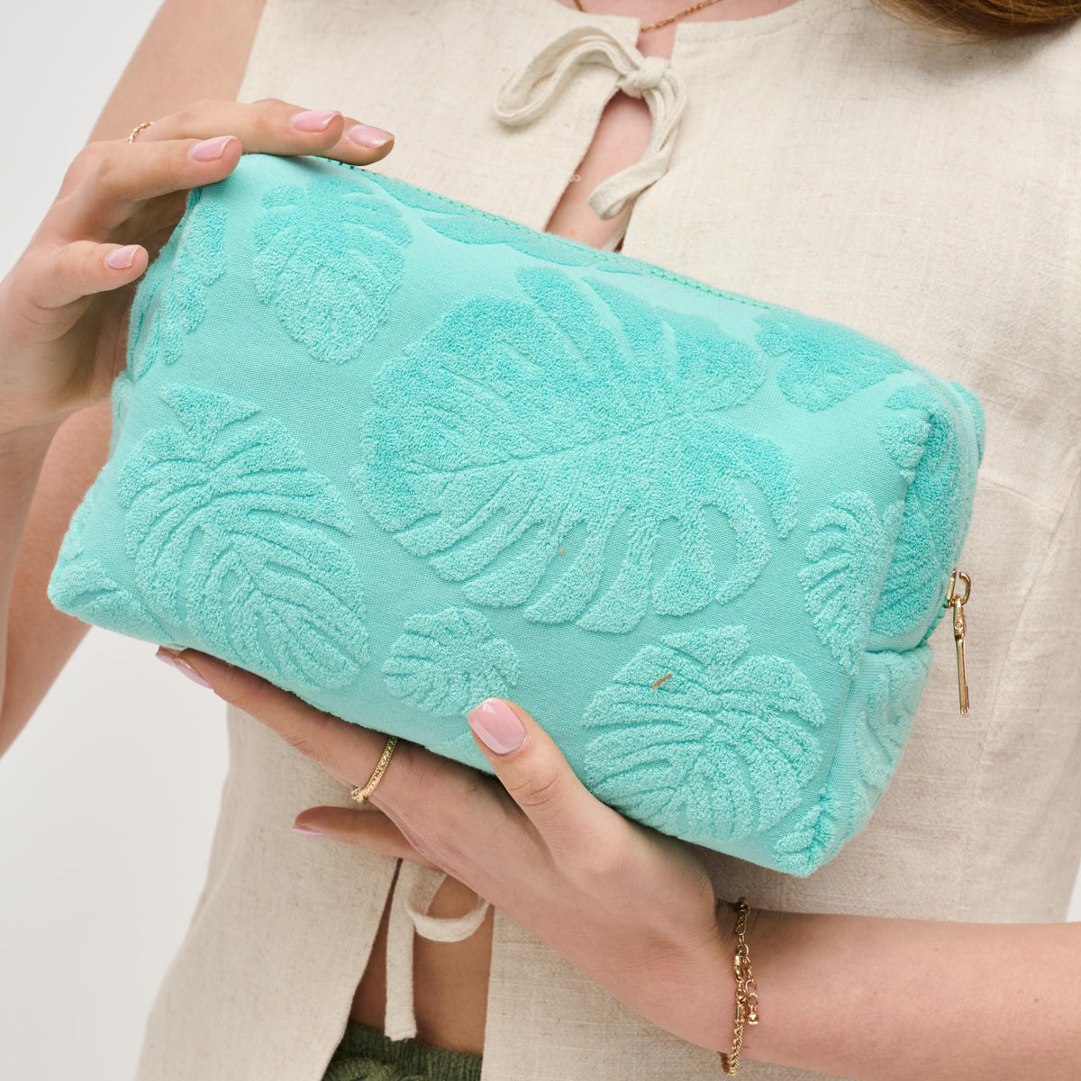 Woman wearing Seafoam Urban Expressions Palm Breeze Cosmetic Pouch 840611195319 View 1 | Seafoam